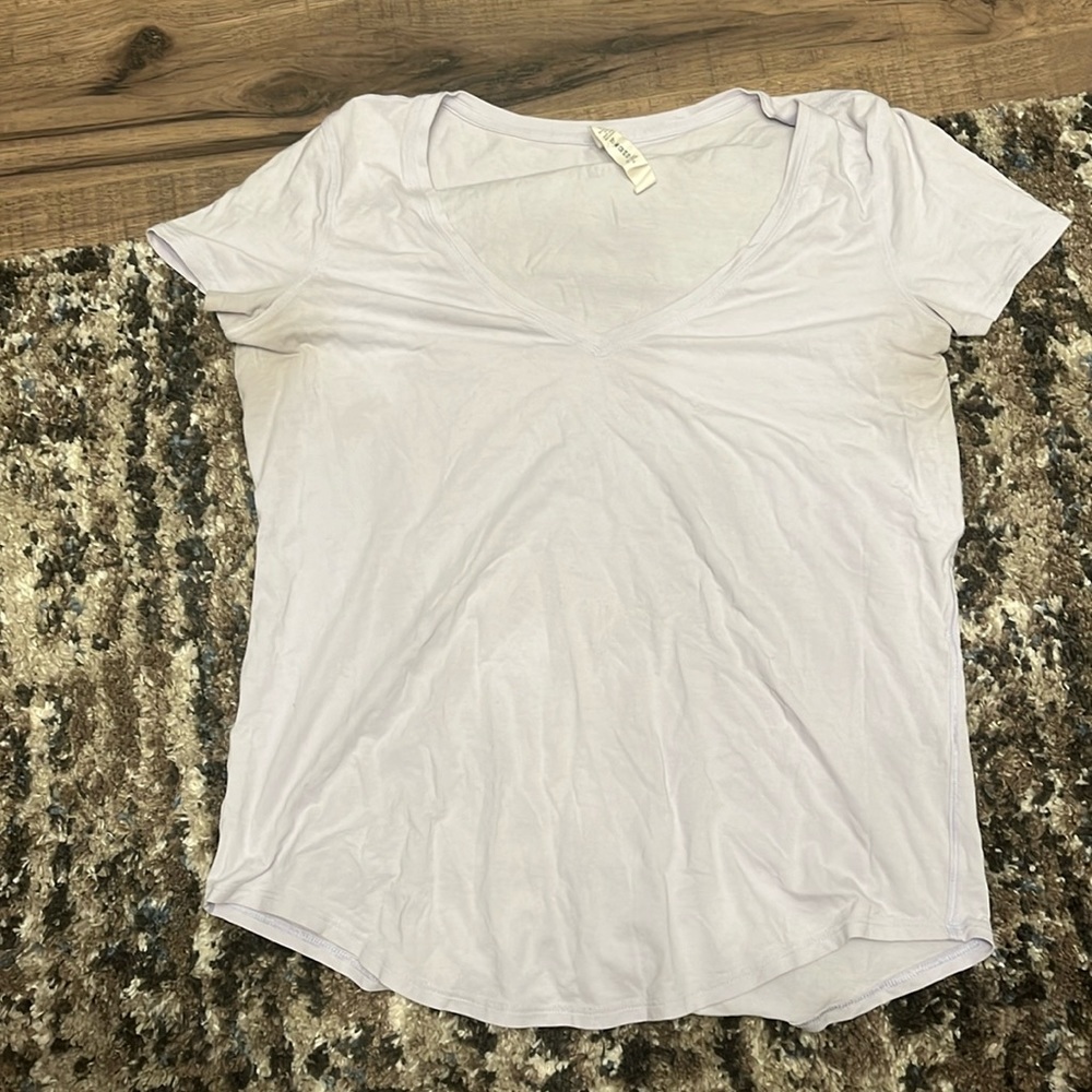 Size 6 Lulu lemon athletic short sleeve shirt with cute scoop detail on bottom